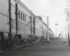 A close up shot of the side of a passenger train as it sits at the station