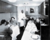 Passengers being served food inside a passenger train