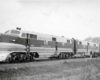 Diesel locomotives hauling a passenger train.