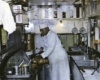 A railway chef in his kitchen. Color photo.