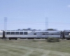 A streamline passenger train seen in a motion blurred image.