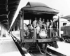 people standing on an observation car