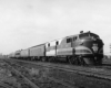 A black and white photo of a Mountaineer locomotive on the tracks