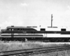 A black and white photo of the Main Central sitting on the tracks