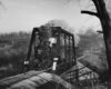 a steam engine crossing a bridge