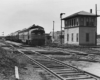 a passenger train passes a train watchtower