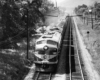 A black and white overhead shot of a train passing by