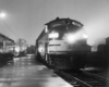 a diesel at a passenger depot at night