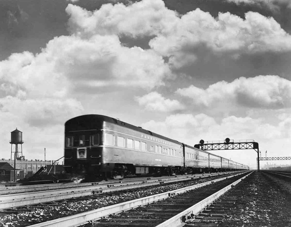 A train passing below a stop light