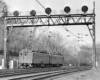 A train passing below a stop light