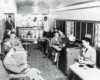 People sitting and talking inside a train