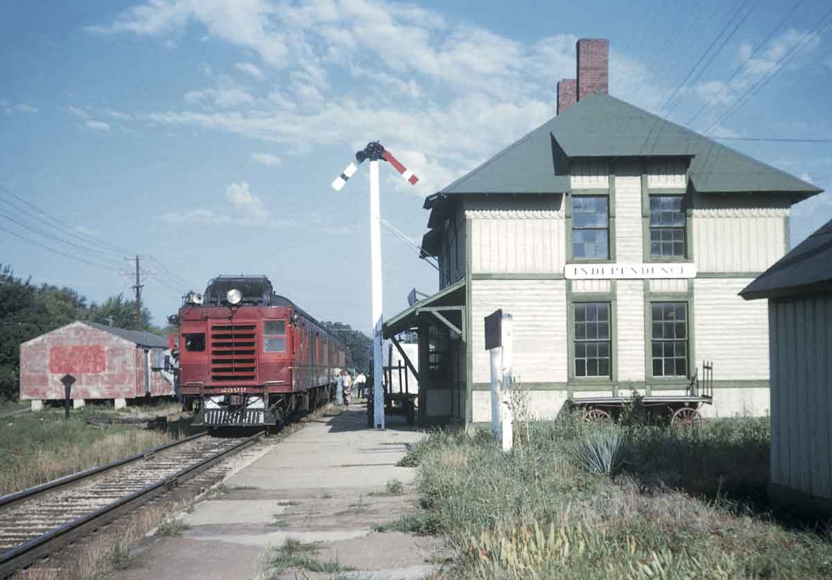 a motor train by a train station
