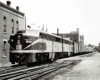 A train parked outside a brick building