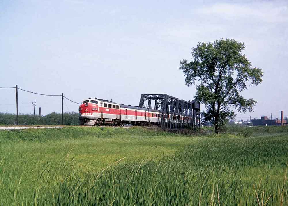 a diesel pulling passenger cars over a train
