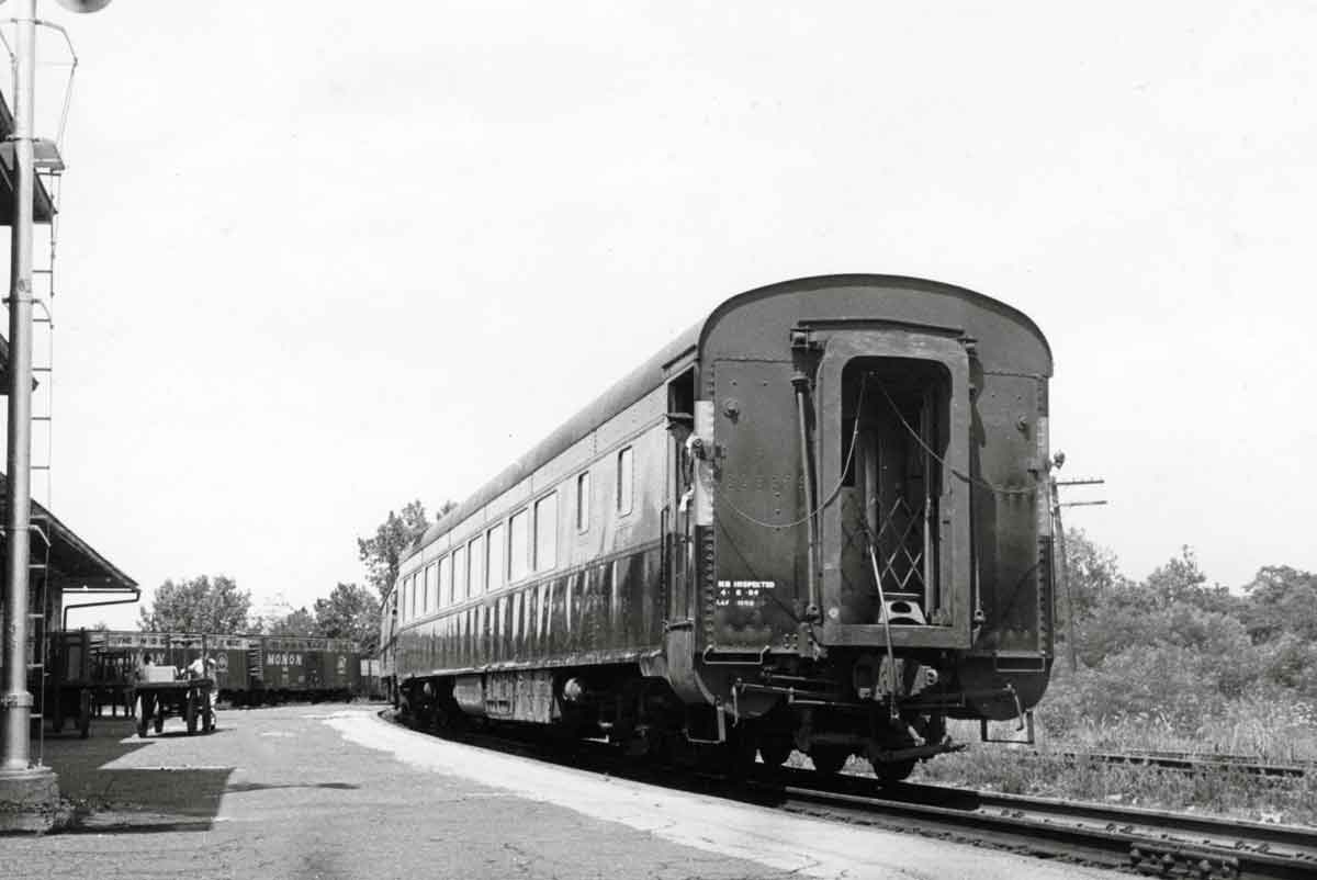 a passenger train at a passenger depot