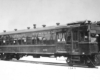 A black and white photo of a train car against a white background