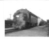 A black and white head on shot of a train