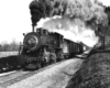 A black and white picture of the locomotive 4-6-0 419 on the tracks with smoke coming out