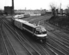 Diesel powered passenger train on curve by downtown station