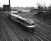 Diesel powered passenger train on curve by downtown station