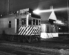 Motor car by station at night