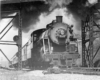 A closeup shot of a train passing through a gate