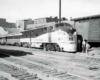 Two people standing outside a train 