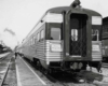 The back of a passenger car sitting on the tracks