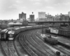 Diesel powered passenger train on curve in urban area