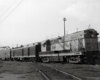 A locomotive departing a train station