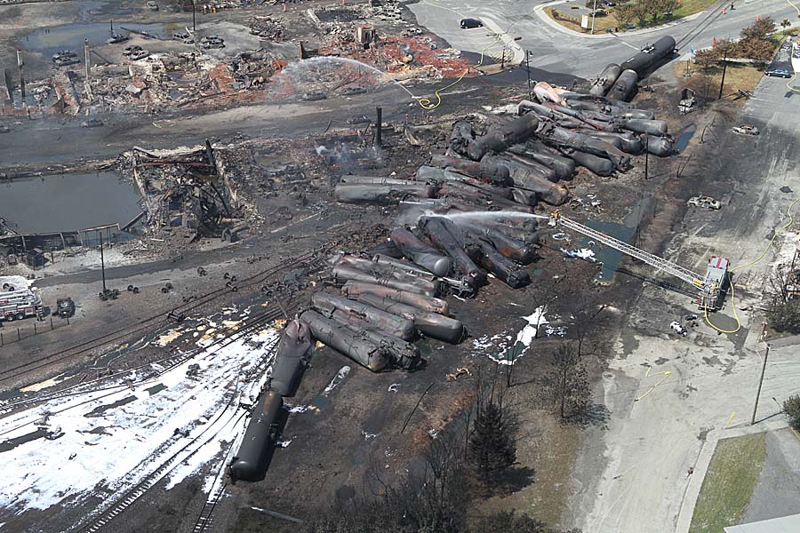 Fire-damaged town and derailed train