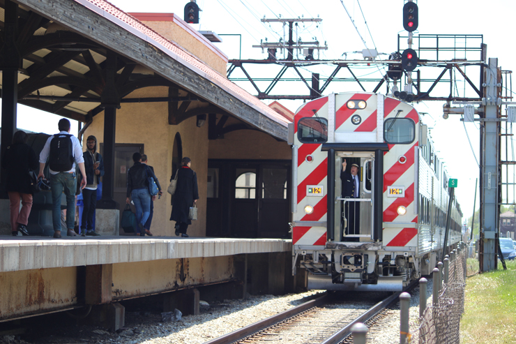 Bilevel electric train arrives at station