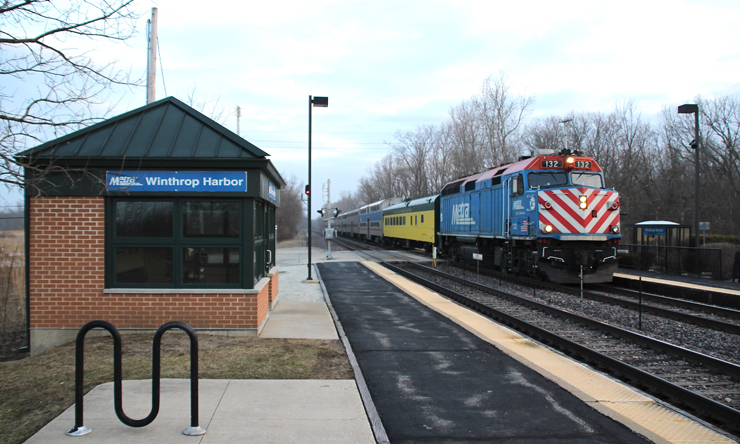 Commuter train at station with "Winthrop Harbor" sign