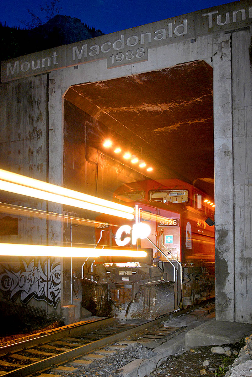Freight train coming out of a tunnel.