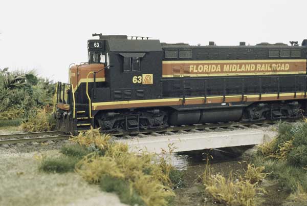 A precast concrete bridge spans a small creek on the Florida Midland RR. 