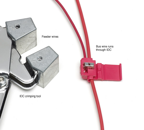 Fig, 3, Suitcase connectors. You can connect bus wires and feeders quickly by using installation displacement connectors, also called suitcase connectors.