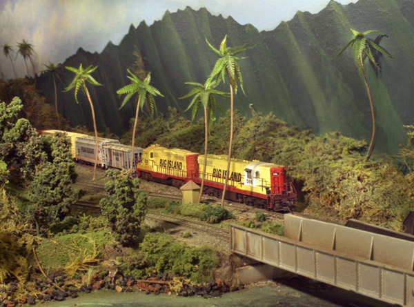 Feather-topped palm trees are a signature element for any model railroad set in a tropical climate.