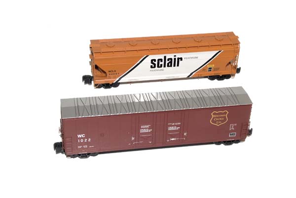 American Car & Foundry three-bay Center Flow covered hopper and Evans 52-foot double-plug-door boxcar