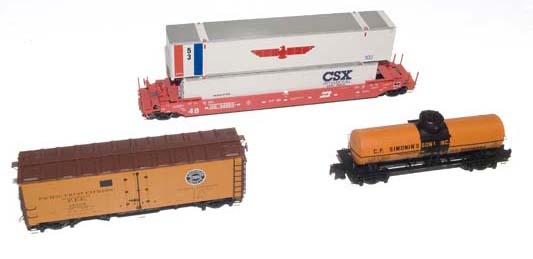 Husky-Stack intermodal well car, 8,000-gallon tank car, and Pacific Fruit Express class R-40-23 40-foot steel refrigerator car