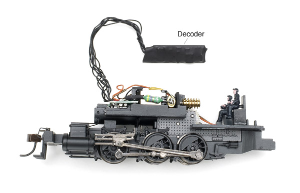 The frame of the 0-6-0T is die-cast metal, and the model’s mechanism takes up most of the space inside the boiler. The cab includes painted crew figures.