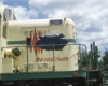 Nose of yellow diesel locomotive with coal logo