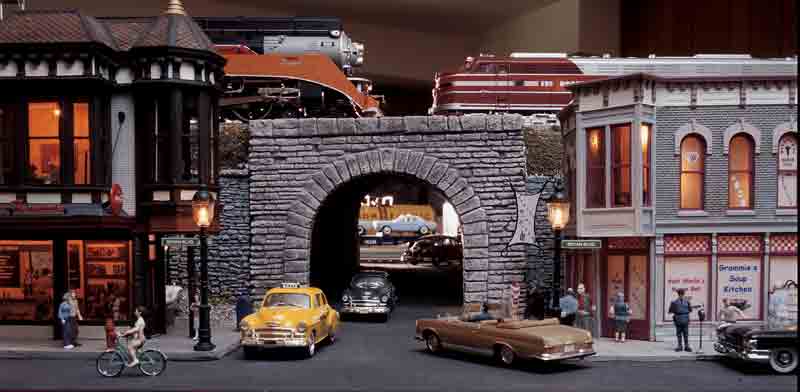 layout scene with cars and two trains