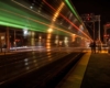 The metra speeding by after dropping off passengers in the dark