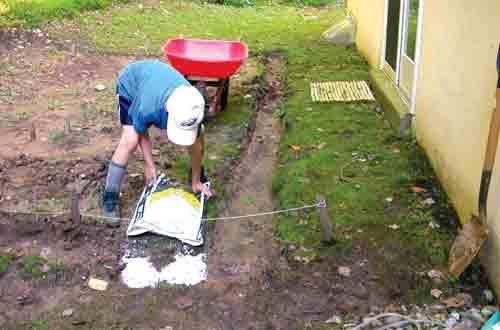 person digging trench