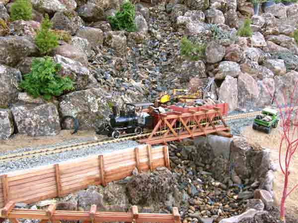 train on bridge of garden railway