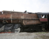 A man working on top of a train