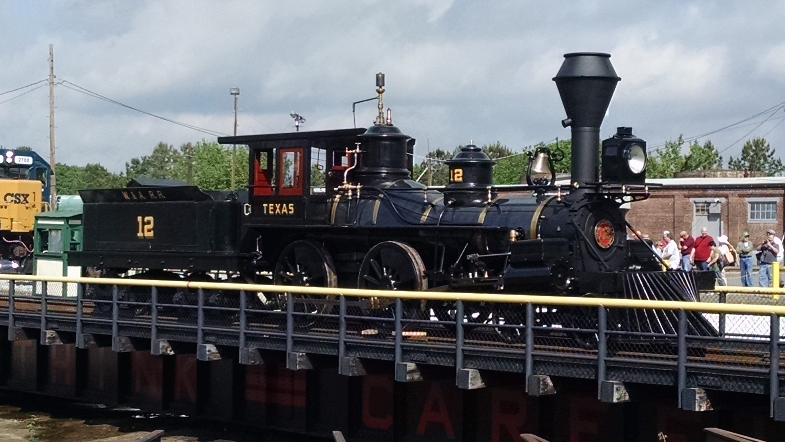 Steam locomotive from the 19 Century displayed on a turntable. 