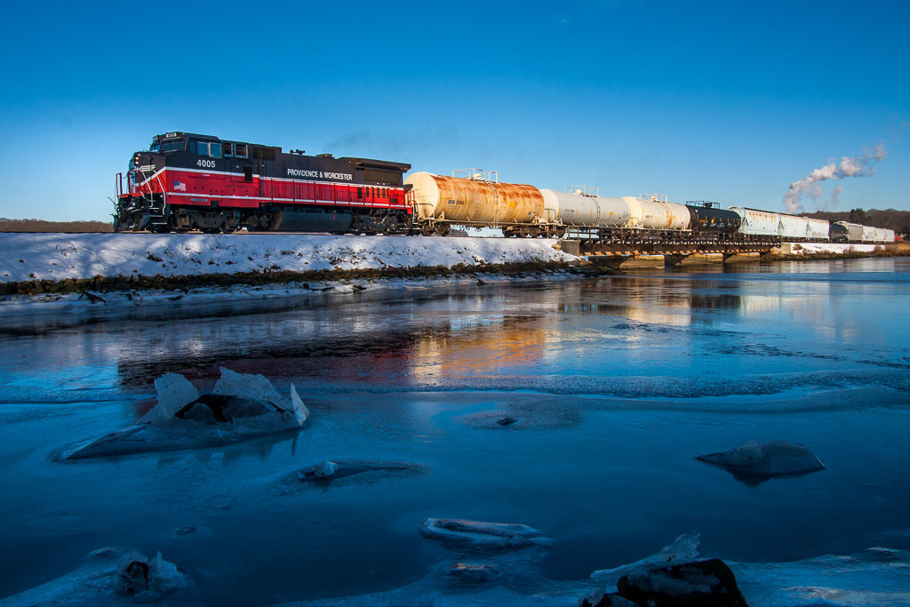 A train traveling over an icy bridge