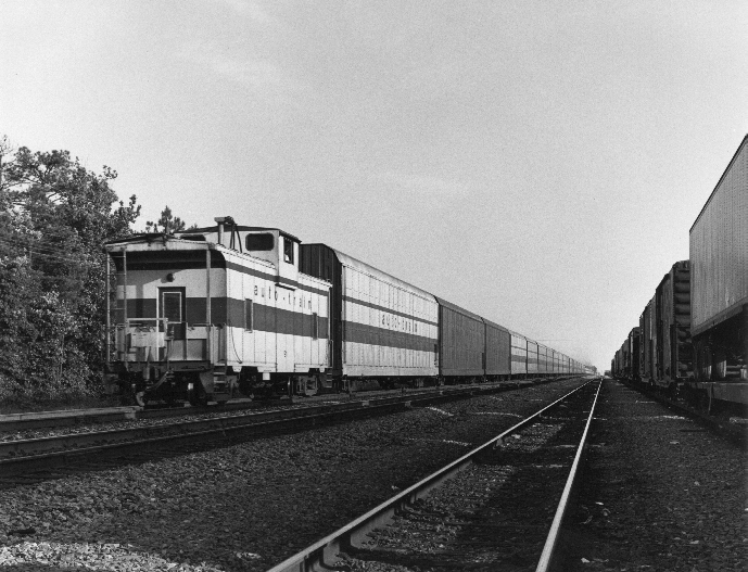 black and white photo of auto train