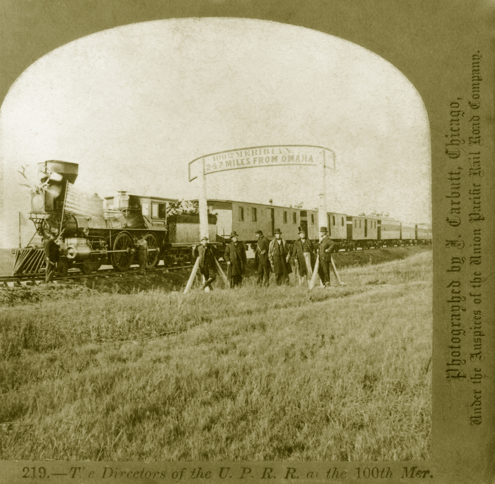 Union Pacific directors pose at the 100th Meridian, 247 miles west of Omaha, Neb. There were still many miles to go to reach Ogden, Utah.